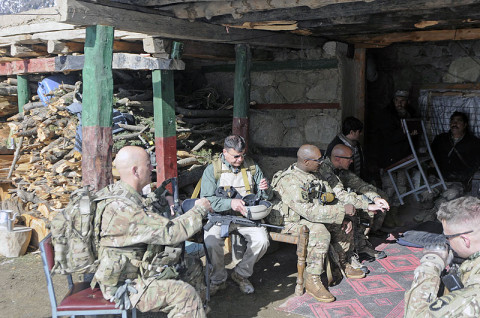 Leadership from 2nd Battalion, 1st Brigade Combat Team, 101st Airborne Division, along with members of Security Forces Assistance and Advisory Team from Combat Outpost Monti, sit in a meeting with the commander of Observation Point 12 Jan. 21st, 2013. (U.S. Army Photo by Sgt. Jon Heinrich, CT 1-101 Public Affairs)