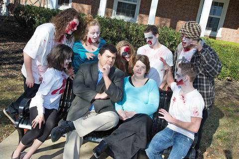 APSU associate professor of history Dr. Antonio Thompson and his wife, APSU associate professor of biology Dr. Amy Thompson, discuss the zombie apocalypse with APSU students dressed as zombies. The students include Richard Borges, Kylee Dick, Amanda Gruver, Raistlin Delisle, Maja Paro, Eric Roberts, and Dustin Waters. (Photo by Beth Liggett/APSU staff)