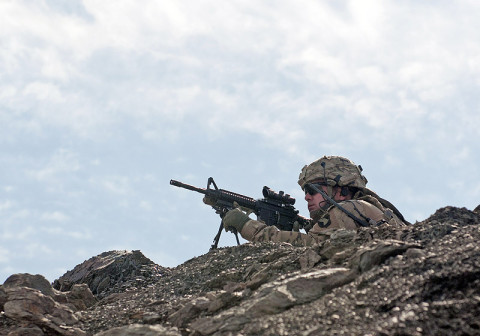 U.S. Army Staff Sgt. Andrew Wood, a section leader with 3rd Platoon, Troop A, 1st Squadron, 33rd Cavalry Regiment, 3rd Brigade, 101st Airborne Division (Air Assault), pulls security on a ridge, Feb. 12, 2013, in Paktya Province, Afghanistan. The platoon conducted a joint patrol with the Afghan Uniformed Police. (U.S. Army photo by Spc. Alex Kirk Amen, 115th Mobile Public Affairs Detachment)