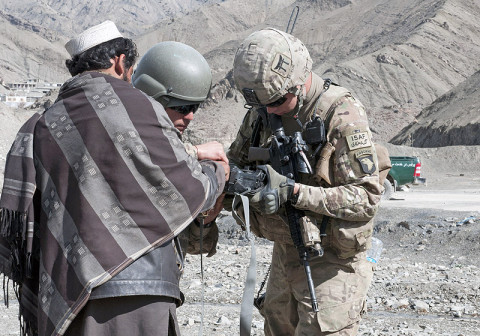 U.S. Army Spc. Adam Baker, a team leader with 3rd Platoon, Troop A, 1st Squadron, 33rd Cavalry Regiment, 3rd Brigade, 101st Airborne Division (Air Assault), enrolls a local Afghan in to the secure electronic enrollment kit, Feb. 12, 2013, in Paktya Province, Afghanistan. The SEEK is used to identify locals in order to increase security. (U.S. Army photo by Spc. Alex Kirk Amen, 115th Mobile Public Affairs Detachment) 