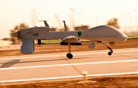 An MQ-1C Gray Eagle unmanned aircraft makes its way down an airfield on Camp Taji, Iraq, before a surveillance mission in the Baghdad area. The Gray Eagle is the Army’s newest “eyes in the sky,” and is being tested by Quick Reaction Capability 1-Reaction 1, the only unit using the aircraft in Iraq. (U.S. Army photo by Spc. Roland Hale, eCAB, 1st Inf. Div. PAO)