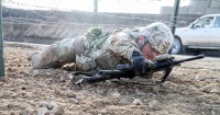 Staff Sgt. Robert Dodge, a cavalry scout assigned to Troop B, 1st Squadron, 33rd Cavalry Regiment, 3rd Brigade Combat Team “Rakkasans,” 101st Airborne Division (Air Assault), low crawls under barbed wire during the obstacle course portion of the brigade noncommissioned officer and Soldier of the quarter competition on Forward Operating Base Salerno, Afghanistan, Feb. 15, 2013. Competitors were timed on performing a five mile road march as well as complete five stations throughout the competition. (U.S. Army photo by Spc. Brian Smith-Dutton, Task Force 3/101 Public Affairs)