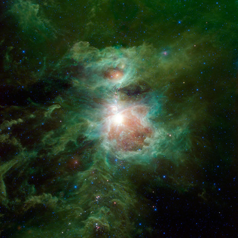 The Orion nebula is featured in this sweeping image from NASA's Wide-field Infrared Survey Explorer, or WISE. The constellation of Orion is prominent in the evening sky throughout the world from about December through April of each year. The nebula (also catalogued as Messier 42) is located in the sword of Orion, hanging from his famous belt of three stars. The star cluster embedded in the nebula is visible to the unaided human eye as a single star, with some fuzziness apparent to the most keen-eyed observers. (Image Credit: NASA/JPL-Caltech/UCLA)