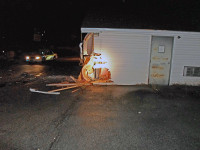 Golden Thimble Tailor Shop was backed into by Nissan Altima causing damage to the building. (Photo by CPD Sgt Greg Beebe)