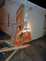 Golden Thimble Tailor Shop was backed into by Nissan Altima causing damage to the building. (Photo by CPD Sgt Greg Beebe)