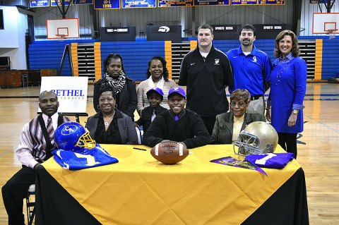 Clarksville Academy senior Ron Washington, family, football coach Todd Hood and Head of School Kay Drew.