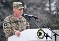 U.S. Army Maj. Gen. James C. McConville, commander of the 101st Airborne Division (Air Assault) and Combined Joint Task Force-101, addresses the audience at a transfer of authority ceremony at Bagram Air Field, Afghanistan, March 14, 2013. The 101st Airborne Division (Air Assault) assumed responsibility of Regional Command-East from the 1st Infantry Division. (U.S. Army photo by Staff Sgt. David J. Overson, 115th Mobile Public Affairs Detachment)