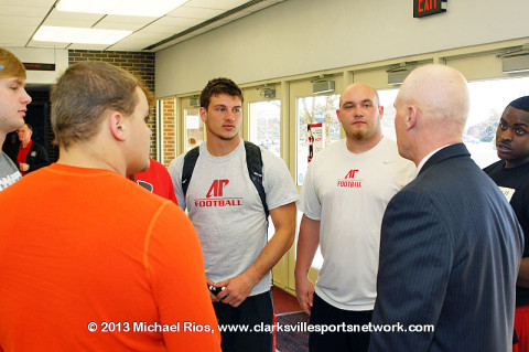 APSU Coach Kirby Cannon talking to some APSU Football Players.