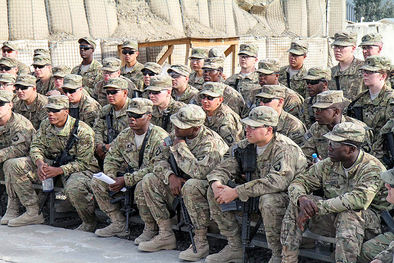 U.S. Army Soldiers assigned to 1st Squadron, 33 Cavalry Regiment, 3rd Brigade Combat Team “Rakkasans,” 101 Airborne Division (Air Assault), listen to Lt. Col. Donald Evans, the squadron commander, as he informs them of their mission success during their deployment at Camp Clark, Afghanistan, March 4, 2013. (U.S. Army photo by Spc. Brian Smith-Dutton TF 3/101 Public Affairs)