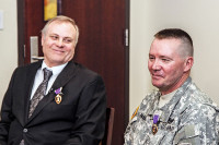 Staff Sgt. Richard McLain, (right) and Sgt. Donnie Roach take questions from the media following their Purple Heart Award Ceremony at Fort Campbell. Roach, a Vietnam Veteran, received his award more than 40 years after being wounded in the Vietnam War (Photo by Sgt. Joe Padula)