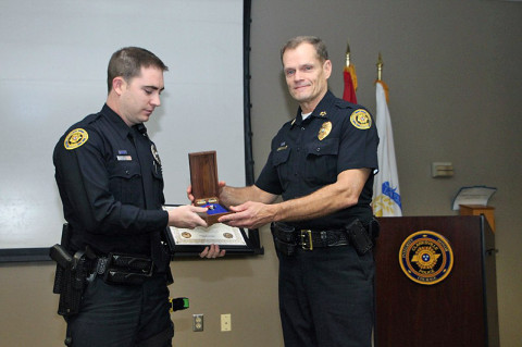 Clarksville Police Officer Seth Paugh (left) receives Lifesaver Award from  Chief Al Ansley (right), Friday, March 8th, 2013. (Photo by CPD-Jim Knoll)