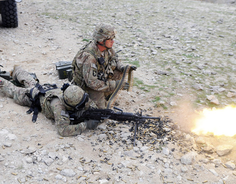 U.S. Army Spc. Sean Michaels, a motor transport operator with Company A, 426th Brigade Support Battalion, 1st Brigade Combat Team, 101st Airborne Division, and native to Horseheads, N.Y., fires the MK-48 machine gun March 20 at a range outside Forward Operating Base Mehtar Lam, Afghanistan. (U.S. Army photo by Sgt. Jon Heinrich, CT 1-101 Public Affairs)