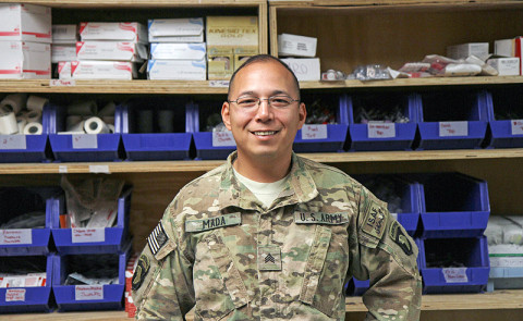 Army Sgt. Luciano Mada, a medic assigned to Headquarters, Headquarters Company, 3rd Battalion, 187th Infantry Regiment, 3rd Brigade Combat Team “Rakkasans,” 101st Airborne Division (Air Assault), poses for a photo at the medical center at Forward Operating Base Salerno, Afghanistan, April 10, 2013. Mada spent his deployment training Afghan National Security Forces to become medics for their units. (U.S. Army Photo by Spc. Brian Smith-Dutton TF 3/101 Public Affairs)