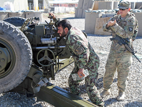 Army Sgt. Daniel Clampitt, an artilleryman assigned to 3rd Battalion, 320th Field Artillery Regiment, 3rd Brigade Combat Team “Rakkasans,” 101st Airborne Division (Air Assault), reads off the coordinates to an Afghan National Army soldier as part of training at Camp Parsa, Afghanistan, March 30, 2013. Clampitt has worked with the 203rd Afghan Army Corps, 1st Infantry Brigade, 4th Kandak, D-30 Heavy Koy throughout the deployment to improve their efficiency with the D-30 Howitzer Cannon. (U.S. Army Photo by Spc. Brian Smith-Dutton TF 3/101 Public Affairs)