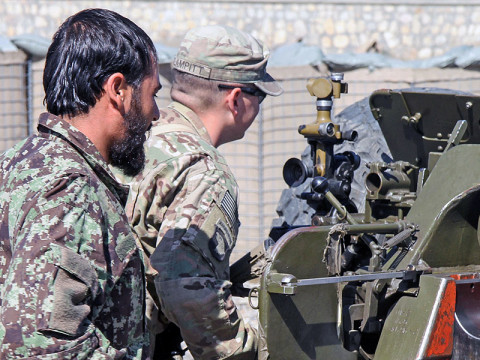 Army Sgt. Daniel Clampitt, an artilleryman assigned to 3rd Battalion, 320th Field Artillery Regiment, 3rd Brigade Combat Team “Rakkasans,” 101st Airborne Division (Air Assault), checks the work of an Afghan National Army soldier for practice at Camp Parsa, Afghanistan, March 30, 2013. Clampitt has worked with the 203rd Afghan Army Corps, 1st Infantry Brigade, 4th Kandak, D-30 Heavy Koy throughout the deployment to improve their efficiency with the D-30 Howitzer Cannon. (U.S. Army Photo by Spc. Brian Smith-Dutton TF 3/101 Public Affairs)