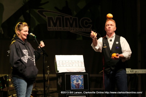 Magician Russ Nowack performs  a magic trick with the assistance of an audience member during Clarksville's Got Talent on the Courthouse Stage at the 2013 Rivers and Spires Festival. The event was co-sponsored by Miller Motte Technical College.