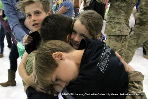 This soldier is surrounded by the love of his children