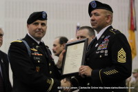 Colonel Valery C. Keaveny, Jr. poses for a photo with Command Sergeant Major Ryan Alfaro after designating him a Distinguished Member of the Regiment