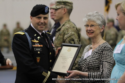 Colonel Valery C. Keaveny, Jr. poses for a picture with Robin Sink McCelland the daughter of the first Regimental Commander of the Currahees as Ms. Leoni Wenstedt looks on