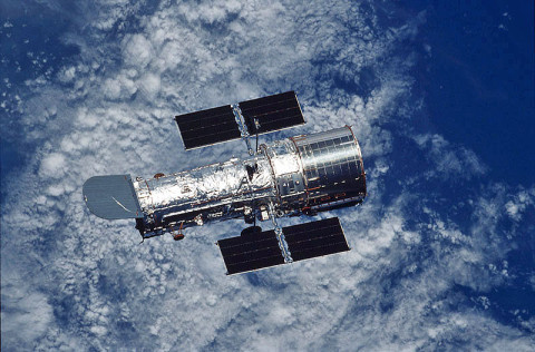 The Hubble Space Telescope floats against the background of Earth after a week of repair and upgrade by Space Shuttle Columbia astronauts in 2002. (Credit: NASA/STSCI)