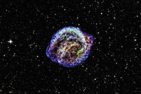 This composite of images from NASA's Chandra X-ray Observatory shows the remnant of Kepler's supernova in low (red), intermediate (green) and high-energy (blue) X-rays. The background is an optical star field taken from the Digitized Sky Survey. The distance to the object is uncertain, with estimates ranging from 13,000 to 23,000 light-years, but recent studies favor the maximum range. This image spans 12 arcminutes or about 80 light-years at the greatest distance. *Credit: X-ray: NASA/CXC/NCSU/M.Burkey et al.; optical: DSS)