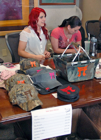 Family Readiness Group leaders and other family members of the 3rd Brigade Combat Team “Rakkasans,” 101st Airborne Division socialize with each other April 18th at a “Rak Sale” in the brigade conference room. (U.S. Army photo taken by Sgt. Alan Graziano, 3rd Brigade Combat Team, 101st Airborne Division)