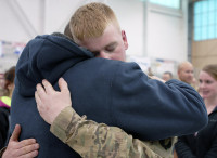 Spc. Robert Fay Jr., an infantryman from Company D, 3rd Battalion, 187th Infantry Regiment, 3rd Brigade Combat Team “Rakkasans,” 101st Airborne Division, reunites with his father, Robert Fay, a former Rakkasan, March 27 at a welcome home ceremony at Fort Campbell, Ky. Although not at the ceremony, Fay’s grandfather is also a former Rakkasan, and the three generations of the Fay family have served the elite 187th Infantry Regiment in several wars dating back to the beginning of its history. (U.S. Army photo taken by Sgt. Alan Graziano, 3rd Brigade Combat Team, 101st Airborne Division)