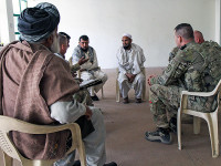 U.S. Army Maj. Gregory Motz, the executive officer for the Khowst Province Provincial Reconstruction Team, of the 5-19th Agribusiness Development Team, Indiana National Guard, along with his team, meets with local farmers and area representatives to discuss various agriculture techniques, in Khowst Province, Afghanistan, March 16, 2013. Motz and his team have been educating local farmers on more proficient ways of handling their crops and livestock throughout this deployment. (U.S. Army Photo by Spc. Brian Smith-Dutton TF 3/101 Public Affairs)