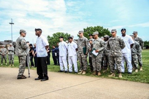 Col. Dan Walrath, commander of the 2nd Brigade Combat Team, 101st Airborne Division (Air Assault), congratulates the culinary Soldiers of the Strike Brigade outside of the Strike Dining Facility, Fort Campbell, Ky., May 16. The Soldier chefs were awarded Fort Campbell’s Commanding General’s Best Dining Facility Award for the 2nd Quarter of fiscal year 2013. (U.S. Army photo by Sgt. Joe Padula, 2nd BCT PAO, 101st Abn. Div.)