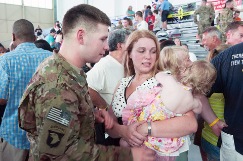 Sgt. Kyle Zobel, Headquarters and Headquarters Company, 101st Combat Aviation Brigade, 101st Airborne Division (Air Assault,) reunites with his wife Christine after returning from a nine-month deployment at Fort Campbell, Ky., May 18, 2013. (U.S. Army photo by Sgt. Duncan Brennan)