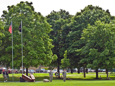 Soldiers prepare to assist Col. Scott Brower, commander of the 5th Special Forces Group (Airborne), in the laying of a wreath at one end of Gabriel Field in remembrance of the heroic service of the unit's fallen during a Memorial Ceremony May 18, 2013. Gabriel Field was named in honor of Specialist 5 James P. Gabriel, who was one of the first Green Berets to be killed in Vietnam. It is memorialized with 57 markers placed around the perimeter of the field, each shadowed by an oak tree in remembrance of those who paid the ultimate sacrifice in training or combat operations. (Photo by Staff Sgt. Barbara Ospina) Soldiers prepare to assist Col. Scott Brower, commander of the 5th Special Forces Group (Airborne), in the laying of a wreath at one end of Gabriel Field in remembrance of the heroic service of the unit's fallen during a Memorial Ceremony May 18, 2013. Gabriel Field was named in honor of Specialist 5 James P. Gabriel, who was one of the first Green Berets to be killed in Vietnam. It is memorialized with 57 markers placed around the perimeter of the field, each shadowed by an oak tree in remembrance of those who paid the ultimate sacrifice in training or combat operations. (Photo by Staff Sgt. Barbara Ospina)