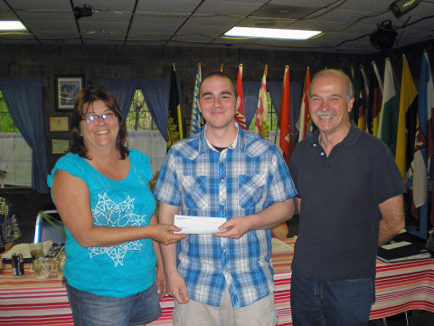 Andrew Beaudoin (middle), who is studying German at Austin Peay State University, receives a scholarship from Debbie Whitaker (left), president of the Clarksville Edelweiss Club. Dr. Norbert Puszkar is on the right. (Photo provided)