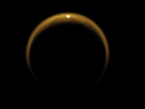 This image shows the first flash of sunlight reflected off a hydrocarbon lake on Saturn's moon Titan. The glint off a mirror-like surface is known as a specular reflection. This kind of glint was detected by the visual and infrared mapping spectrometer (VIMS) on NASA's Cassini spacecraft on July 8th, 2009. (Image credit: NASA/JPL/University of Arizona/DLR)