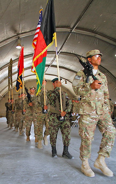 The colors of the 3rd and 4th Brigade Combat Team, 101st Airborne Division, preceded by the national flags of Afghanistan and the United States of America, are marched out at the closing of the transfer of authority ceremony at Forward Operating Base Salerno, on May 22nd, 2013.