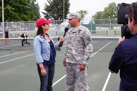 Sgt. 1st Class Matthew Loheide speaks with Great American Country host Nan Kelley Monday, May 20th. (U.S. Army photo by Stacy Rzepka/Released)