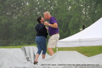 Mike Riley dances with his wife in the rain