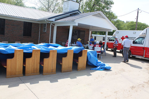 Pews from the Carlisle Missionary Baptist Church drying in the sun after destructive flash flooding.  (Robert W. Wallace)