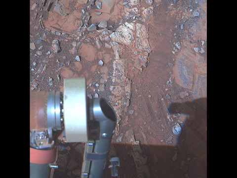 The pale rock in the upper center of this image, about the size of a human forearm, includes a target called "Esperance," which was inspected by NASA's Mars Exploration Rover Opportunity. Data from the rover's alpha particle X-ray spectrometer (APXS) indicate that Esperance's composition is higher in aluminum and silica, and lower in calcium and iron, than other rocks Opportunity has examined in more than nine years on Mars. Preliminary interpretation points to clay mineral content due to intensive alteration by water. (Image Credit: NASA/JPL-Caltech/Cornell/Arizona State Univ.)