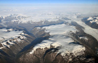 Peripheral glaciers and ice caps (isolated from the main ice sheet, which is seen in the upper right section of the image) in eastern Greenland. (Credit: Frank Paul, University of Zurich.)