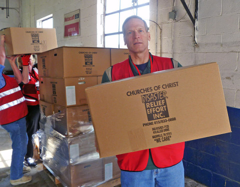 American Red Cross worker Bob Tyler loads food boxes to be distributed to residents of Stewart County, Tennessee, who were affected by recent flash floods in May, 2013. (Robert W. Wallace)