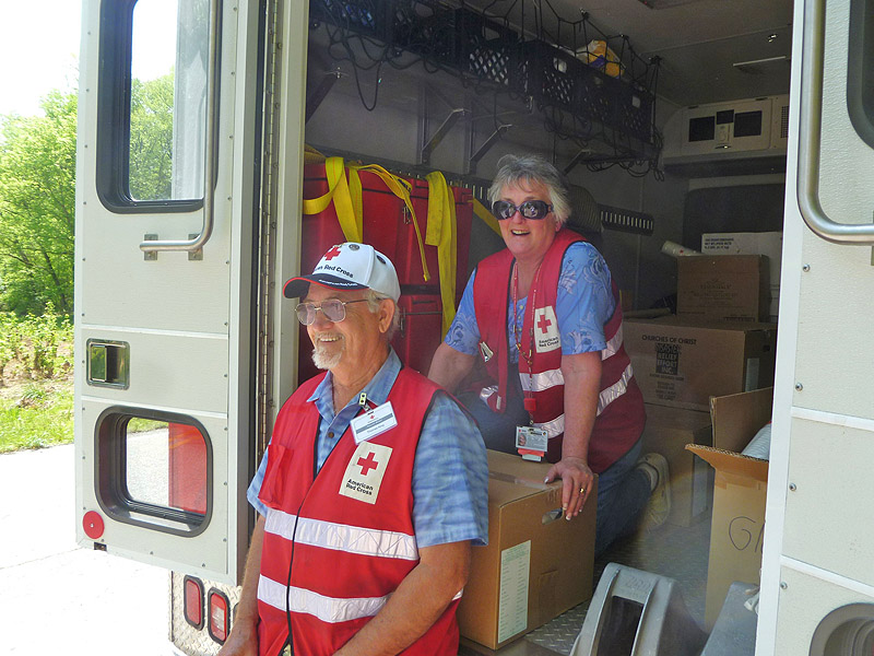 Tom and Rene King, Red Cross volunteers from Nashville, Tennessee, take a break from distributing food and clean-up supplies to persons affected by flash flooding in north-central Tennessee. Tom and Rene are dedicated volunteers who recently responded to the recovery work after Superstorm Sandy. "We signed up 30 years ago," noted Tom, "but it's only during the past two years or so that we've had the time to respond to the call for disaster relief." (Robert W. Wallace)