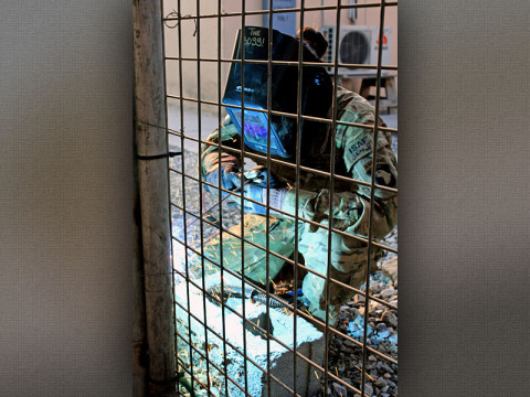 U.S. Army Spc. April Harvey, a metal worker with Company B, 426th Brigade Support Battalion, 1st Brigade Combat Team, 101st Airborne Division (Air Assault), increases security by welding heavy duty hinges onto a series of gates on Forward Operating Base Fenty, Nangarhar province, Afghanistan, Jan. 16, 2013. (U.S. Army Photo by Sgt. 1st Class John D. Brown, CT 1-101 Public Affairs)
