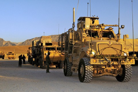 U.S. Soldiers assigned to the 3rd Platoon, 1245th Transportation Company, 1034th Combat Sustainment Support Battalion, escort military vehicles in preparation for a convoy escort team mission en route to two forward operating bases in the Regional Command North, at Mazar-e-Sharif, Balkh province, Afghanistan, June 18, 2013. (U.S. photo by Sgt. Sinthia Rosario/Released)