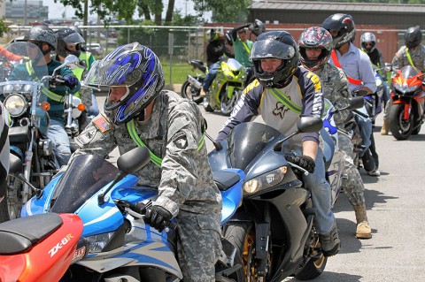 Motorcycle riders within the 3rd Brigade Combat Team "Rakkasans," 101st Airborne Division (Air Assault), prepare to ride their motorcycles to an obstacle course during a mentorship day for riders at Fort Campbell, Ky., June 12, 2013. The Rakkasans have been conducting motorcycle mentorship days for the past eight years, providing assistance and classes to riders within the brigade. (Photo by Army Spc. Brian Smith-Dutton 3/101 Public Affairs)