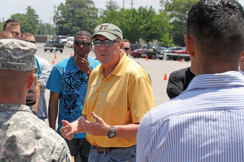 Ralph Stuck, the safety manager for 3rd Brigade Combat Team "Rakkasans," 101st Airborne Division (Air Assault), speaks with Soldiers about the importance of safety while riding their motorcycles during a motorcycle mentorship day event at Fort Campbell, Ky., June 12. Stuck has been hosting motorcycle mentorship days for the Rakkasans for eight years, showing riders that they are supported by the brigade. (Photo by Army Spc. Brian Smith-Dutton 3/101 Public Affairs)