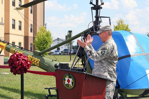 Senior mission commander for the 101st Airborne Division and Fort Campbell Brig. Gen. Mark R. Stammer applauds veterans in attendance who served in the Korean War during a helicopter dedication ceremony June 19, 2013 at the WTB Complex on Fort Campbell, KY. (U.S. Army photo by Victoria Tarter, Blanchfield Army Community Hospital intern from Austin Peak State University)