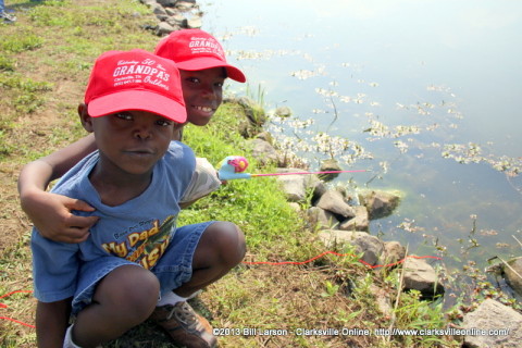 Two boys fishing at Liberty Park during last year's Free Fishing Day.