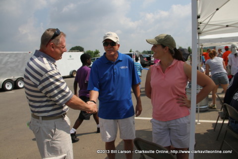 Mark Tummons the Director of the Clarksville Department of Parks and Recreation shakes hands with Clarksville City Councilman Geno Grubbs who was volunteering at the 2013 TWRA Youth Fishing Rodeo.