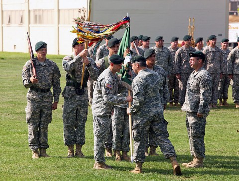 Lt. Col. David Diamond accepts the 1st Battalion, 5th Special Forces Group (Airborne) colors from Col. Scott Brower, commander of the 5th SFG (A), as he assumes command from Lt. Col. Andrew Hanson during a ceremony at Fort Campbell, KY, June 13th, 2013. (U.S. Army photo)