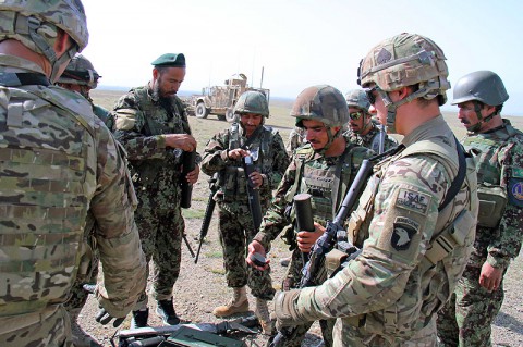 Soldiers with Easy Company, 2nd Battalion, 506th Infantry Regiment, 4th Brigade Combat Team, observe as the Afghan National Army’s 2nd Khandak, 1st Brigade, 203rd Corps, prepare their 60mm mortar prior to a live fire exercise in Khowst Province, Afghanistan, June 22, 2013. (Photo by Sgt. Justin A. Moeller, 4th Brigade Combat Team Public Affairs)